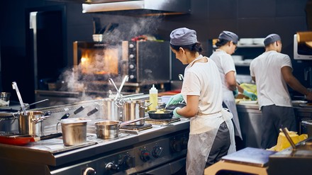 Drei Köche in der Küche