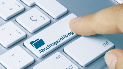 Tastaturknopf mit der Aufschrift "Abschlagszahlung"