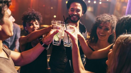 Friends having drinks at the night club party