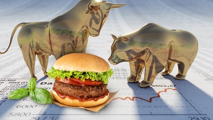 Ein veganer Burger auf einem Börsenpapier