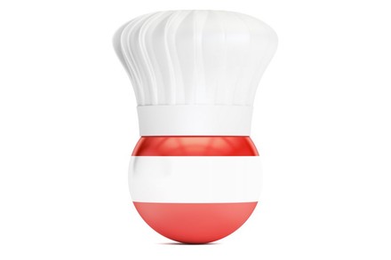 Ball mit Österreich Farben und Kochmütze