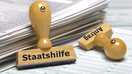 Stempel mit der Staatshilfe und Antrag